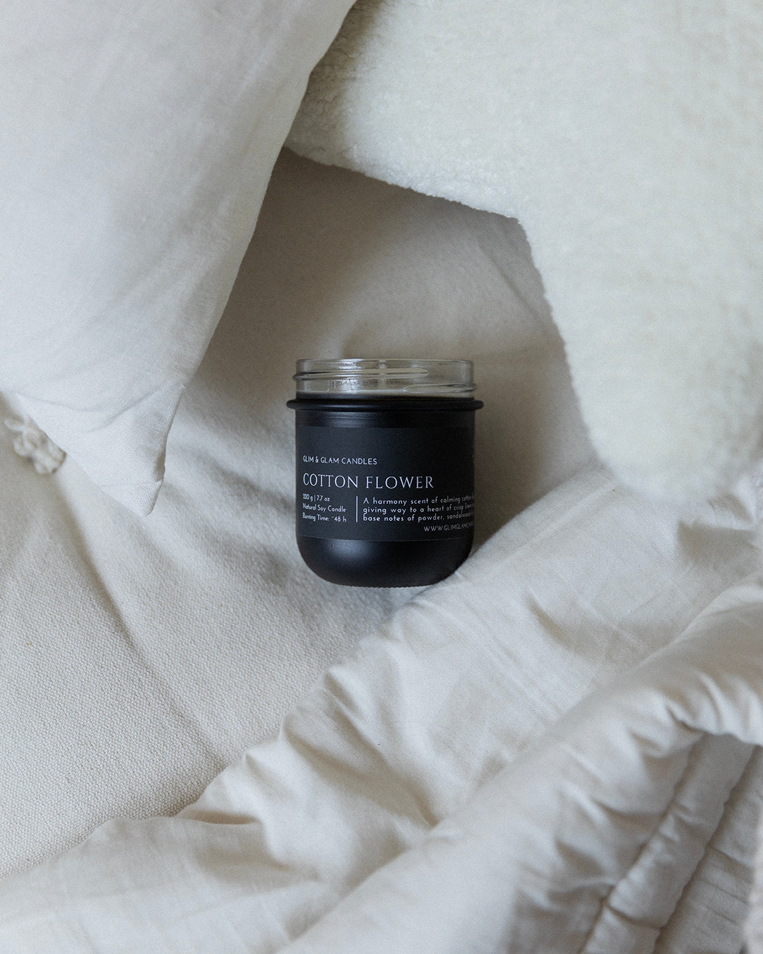 Lifestyle image representing the Black Matte Soy Candles Collection by Glim & Glam, featuring handcrafted soy candles in a warm, nature-inspired home setting.