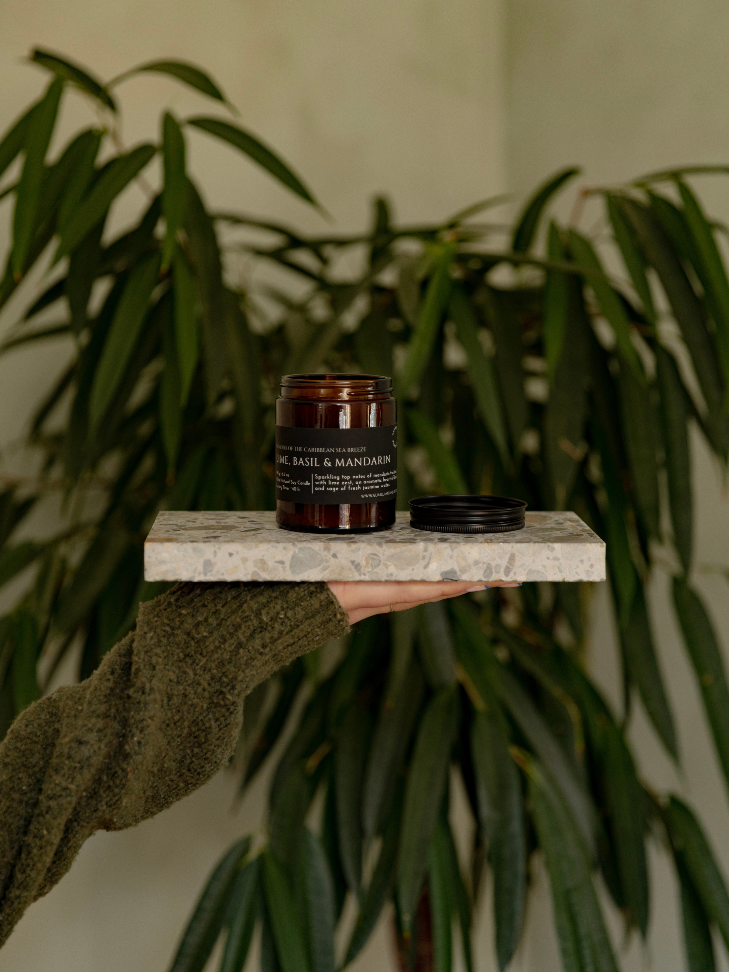 Handcrafted soy candles by Glim & Glam styled in a modern home, showcasing premium natural home fragrance and minimalist design.
