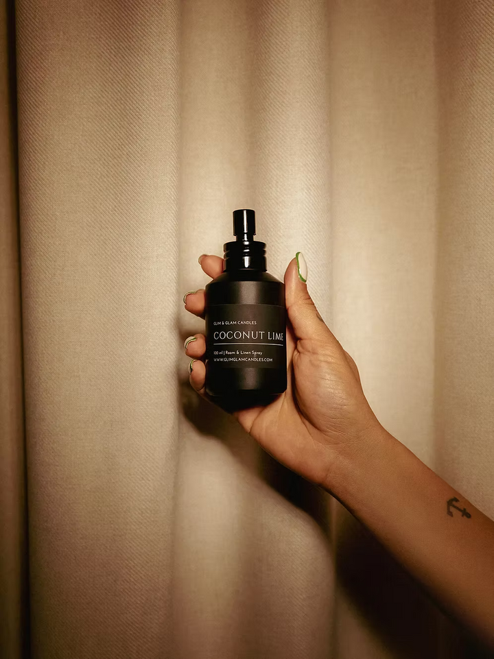COCONUT LIME ROOM AND FABRIC SPRAY in amber bottle for refreshing home fragrance by Glim Glam