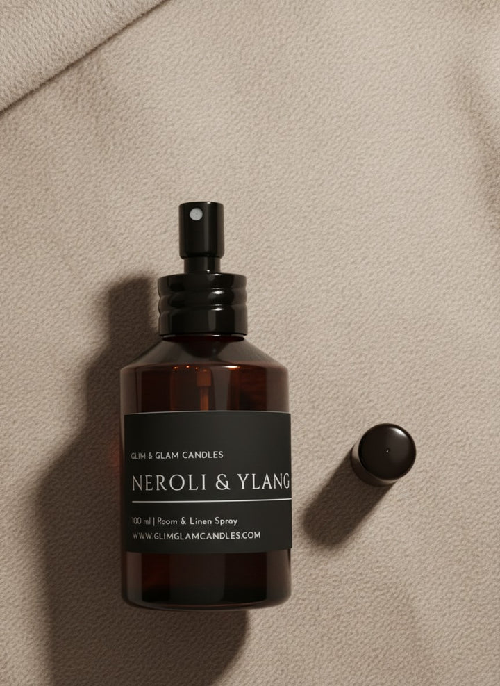 NEROLI & YLANG YLANG ROOM AND FABRIC SPRAY in amber bottle for refreshing home fragrance by Glim Glam