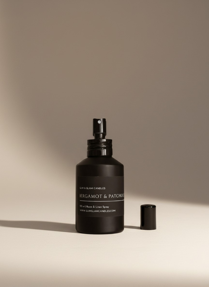 BERGAMOT & PATCHOULI ROOM AND FABRIC SPRAY in black matte bottle for refreshing home fragrance by Glim Glam