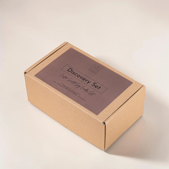 Glim & Glam Discovery Set custom scented soy candle gift box with 5 small amber jar candles.