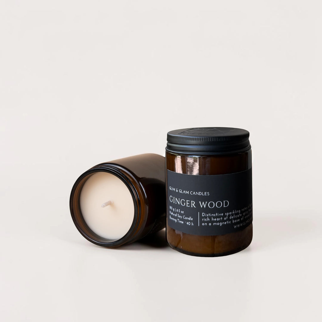 Glim & Glam Ginger Wood soy candle in amber glass jar with black lid. Natural soy wax.