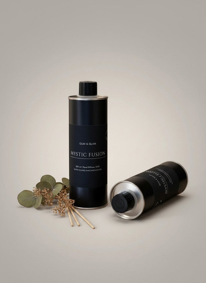 Glim & Glam Mystic Fusion reed diffuser refill bottles in black metal with eucalyptus sprigs and reeds.