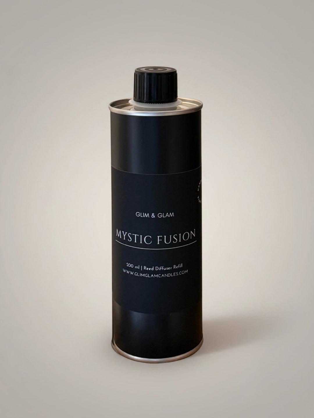 Glim & Glam Mystic Fusion 200ml reed diffuser refill in a sleek black metal bottle for sustainable home fragrance.