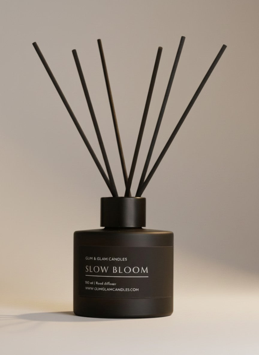 SLOW BLOOM REED DIFFUSER in black matte 100 ml bottle, long-lasting luxury home fragrance by Glim Glam