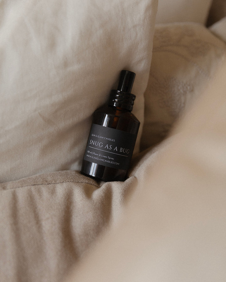 SNUG AS A BUG ROOM AND FABRIC SPRAY in amber bottle for refreshing home fragrance by Glim Glam